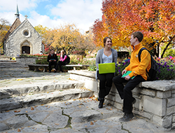 Gradute Students on Marquette University Campus in front of the Joan of Arc Chapel