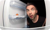 Man looking inside a fridge